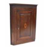 Georgian oak corner cupboard, the dentil moulded cornice over a single panelled door inlaid to the