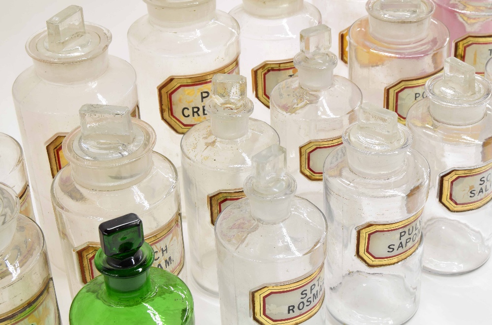 Sixteen Victorian glass apothecary chemist bottles with stoppers, with gilt border labels, (faults), - Image 2 of 2