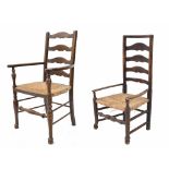 Antique rush seat ladder back low armchair, 38.5" high; together with another similar armchair (2)