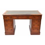 Victorian walnut twin pedestal desk, the green inset leather top over nine drawers to the kneehole