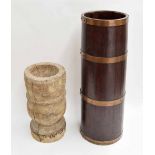 Coopered oak stick stand, brass bound, 25" high, together with a heavy antique wooden urn (2)