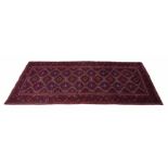 Good Gonbad red ground runner, geometric medallions within multiple geometric borders, 115" x 57"