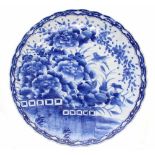 Japanese blue and white porcelain charger, densely decorated with birds within trees within repeated