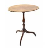 19th century oval mahogany occasional table, the crossbanded tilt-top upon a baluster turned
