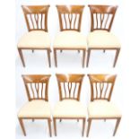 Set of six Biedermeier cherry wood dining chairs, the splayed backs with vertical wishbone spindle