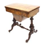 Victorian walnut foldover games/work table, the foliate boxwood inlaid hinged swivel top enclosing