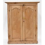 19th century stripped pine cupboard with double panelled doors upon a plinth base, 41" wide, 51.5"