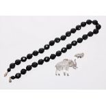 (ref. 2952) faceted black bead necklace and a silver elephant brooch (at fault) (2)