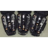 Three contemporary cased clarinets, with Trevor James stamped ferrules (3)