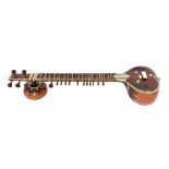 Sitar, India, 20th century, the main gourd body partly overlaid with wooden carved foliage, the