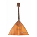 Soprano balalaika, circa 1960, of standard triangular form, the back comprising seven ribs