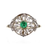 18ct and platinum cabouchon-cut single stone emerald ring within a filigree diamond set surround,