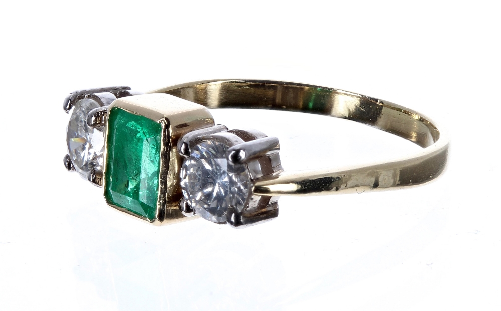 18ct emerald and diamond three stone ring, the centred emerald .70ct, with round brilliant-cut - Image 2 of 2