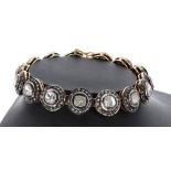 Ornate rose-cut diamond tennis bracelet, with fifteen cluster links each with principal centre
