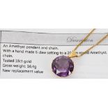 Amethyst 18ct set pendant on a fine curb chain, the round amethyst 20mm diameter mounted in a six-