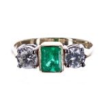 18ct emerald and diamond three stone ring, the centred emerald .70ct, with round brilliant-cut