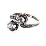 Antique diamond cross-over design ring, with two claw-set old-cut diamonds 1.10ct, clarity SI1-2,