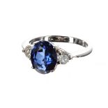 Good 18ct white gold sapphire and diamond three stone ring, the oval sapphire 2.10ct approx, with