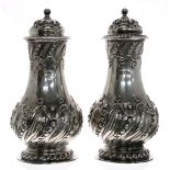 Good pair of late Victorian silver sugar casters, of wrythen fluted baluster form with scrolling