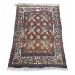 Small natural ground Persian prayer mat, decorated with six floral roundels within flowering vine