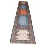Kelim runner, decorated with five panels of geometric medallions, 12' x 31" approx