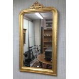 Victorian carved giltwood overmantel mirror, the arched top moulded and beadwork frame surmounted