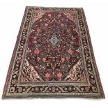 Persian Tabriz type carpet, decorated with central floral medallion within panel of flowers and