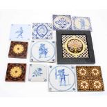 Eleven decorative stoneware glazed tiles, including some Delft examples (faults)