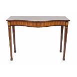 Good mahogany serpentine console table in the Sheraton manner, the frieze inlaid with satinwood