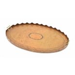 Large oval twin-handled butler's gallery tray, inlaid with an oval paterae on a figured ground,