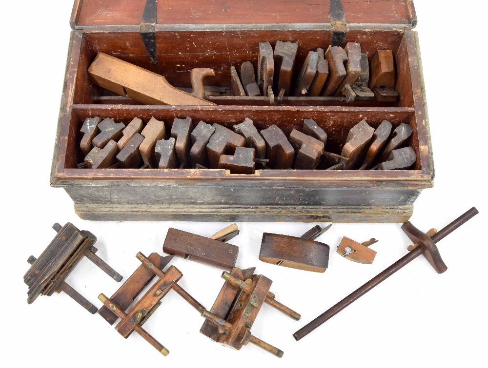 19th century pine tool chest containing a collection of antique woodwork planes, mostly with maker's