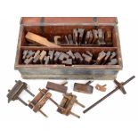 19th century pine tool chest containing a collection of antique woodwork planes, mostly with maker's