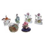 Six assorted Staffordshire pottery figures and models, including pair of birds nest spill vases,