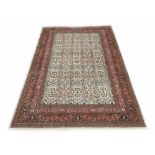 Good Kaysari handmade carpet, with repeated foliate pattern on a natural ground within multiple