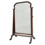 Georgian style walnut dressing mirror, the shaped moulded plate upon tapered cheval type supports