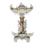 Large German porcelain figural encrusted centrepiece, the serpentine scrolled basket on a