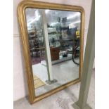 Large Victorian giltwood arched top overmantel mirror with a moulded and gadrooned frame, 52.5"