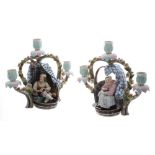 Pair of German 19th century figural porcelain candlesticks, one of a seamstress and the other a