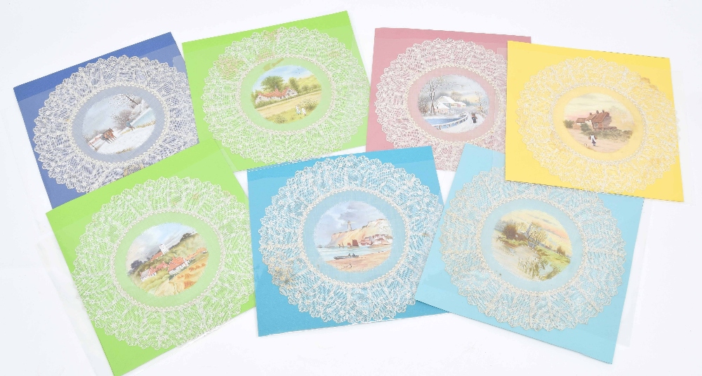 Set of seven painted circular lace coaster mats, centrally decorated with seasonal pastoral