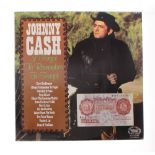 Johnny Cash - autographed ten shilling bank note signed by Johnny Cash and June Carter Cash;