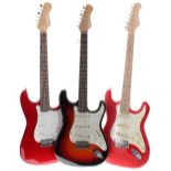 Three Strat style electric guitars