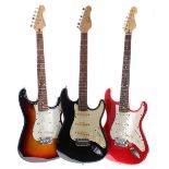 Two Cruiser by Crafter Strat style electric guitars, sunburst and red finishes; together with an