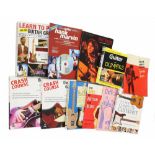 Assortment of books relating to guitar including "Crash Course in Guitar", "The Handbook" and "