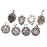 Eight silver fobs (8)