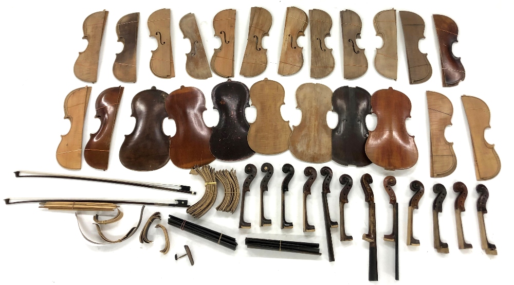 Interesting selection of old violin backs and fronts; also a quantity of violin necks and scrolls,