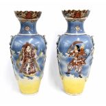Pair of Japanese satsuma vases, each with shaped rim, twin applied rope twist handles and