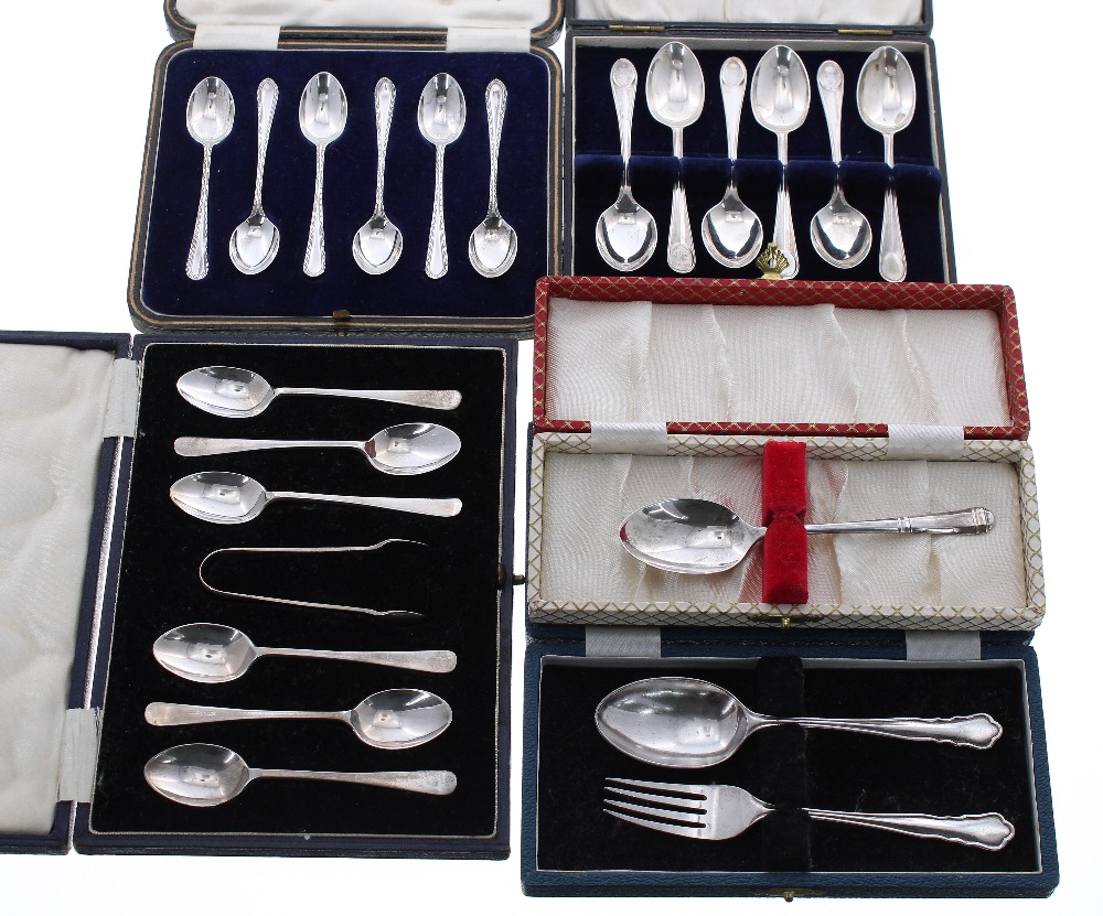 Two cased sets of six silver teaspoons, another cased set of six silver teaspoons with sugar