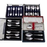 Two cased sets of six silver teaspoons, another cased set of six silver teaspoons with sugar