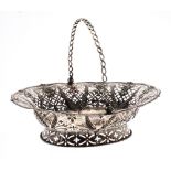 George III pierced silver cake basket, with swag motif panels around a central engraved crest within