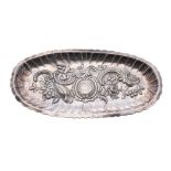 Irish 19th century oval repousse silver tray, decorated with a bird of paradise, floral swags and